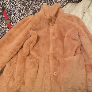 I am selling a light pink faux fur jacket with pockets an a free watch